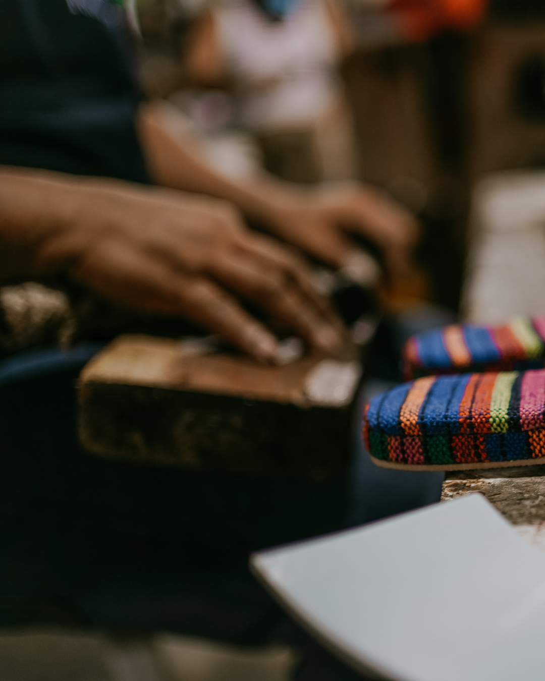 Artisan hands crafting colourful woven shoes in the Element Cairo studio